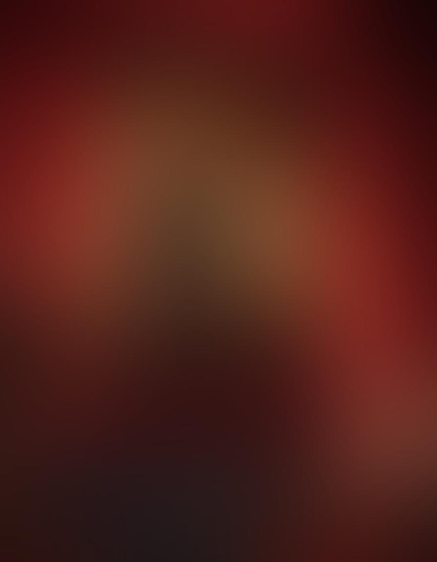 A tantalizingly mysterious scene featuring a velvet red curtain slightly parted to reveal shadowy silhouettes of couples in intimate poses, surrounded by flickering candles and soft ambient lighting. A sleek, modern laptop sits open in the foreground, displaying a blurred video thumbnail, inviting viewers to explore adult entertainment reviews. Include elements like subtle erotic art pieces in the background and rich textures to invoke a sense of allure and curiosity. vibrant colors. sensual style.